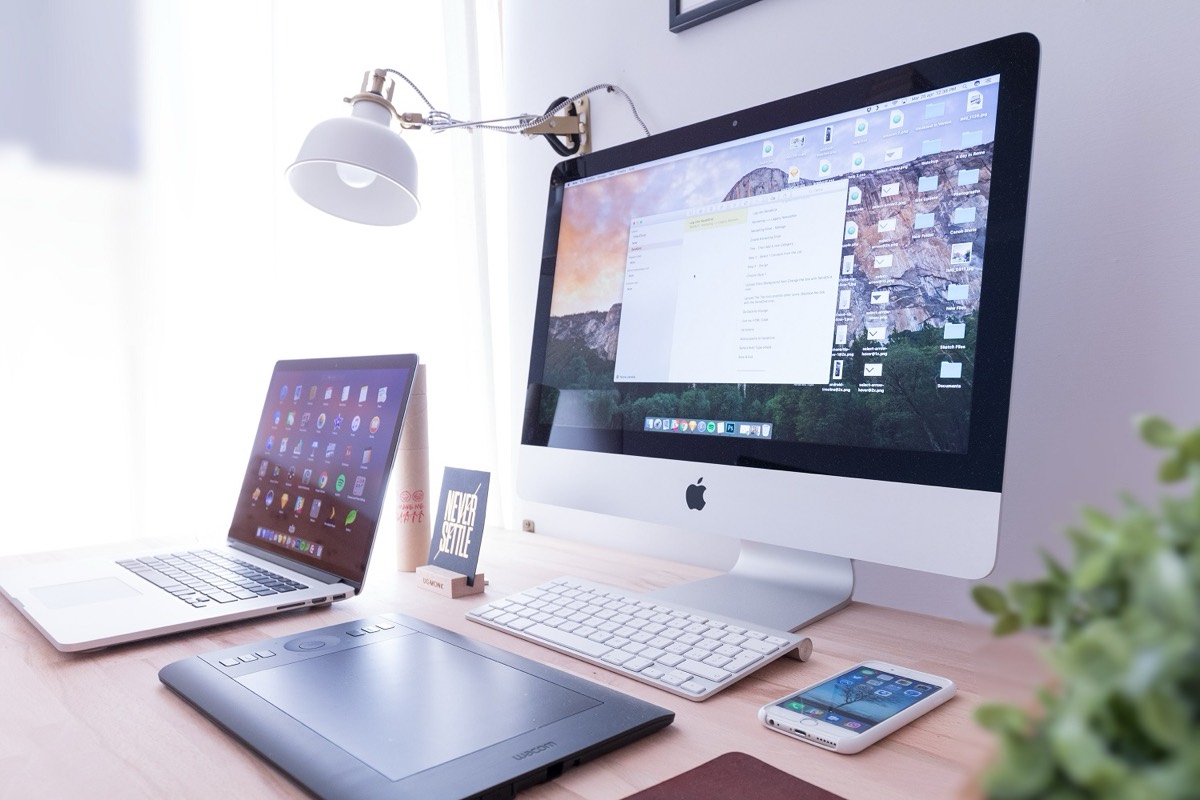 Responsive website design shown on a desktop monitor and a phone