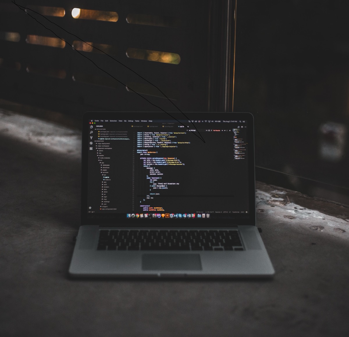 Web application source code open on a laptop screen